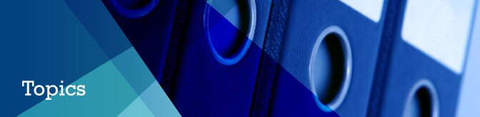 A row of blue folders with strips of blue in different tones